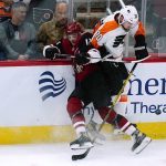 Philadelphia Flyers defenseman Rasmus Ristolainen (70) collides with Arizona Coyotes center Alex Galchenyuk (17) during the first period of an NHL hockey game Saturday, Dec. 11, 2021, in Glendale, Ariz. (AP Photo/Ross D. Franklin)