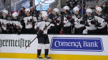 Arizona Coyotes defenseman Janis Moser (62) is congratulated by teammates after scoring a goal agai...