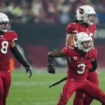 Arizona Cardinals outside linebacker Jordan Hicks (58), defensive tackle Leki Fotu (95) and safety Budda Baker (3) celebrate a defensive stop against the Indianapolis Colts during the second half of an NFL football game, Saturday, Dec. 25, 2021, in Glendale, Ariz. (AP Photo/Ross D. Franklin)