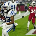 Indianapolis Colts wide receiver T.Y. Hilton (13) scores a touchdown during the first half of an NFL football game against the Arizona Cardinals, Saturday, Dec. 25, 2021, in Glendale, Ariz. (AP Photo/Ross D. Franklin)
