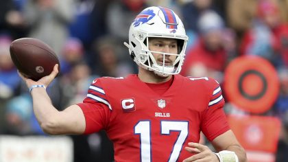 Buffalo Bills quarterback Josh Allen passes in the first half of an NFL football game against the C...