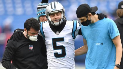Carolina Panthers kicker Zane Gonzalez (5) is helped off the field after an apparent injury during ...