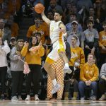 Tennessee forward Olivier Nkamhoua (13) saves the ball from going out of bounds during an NCAA college basketball game against Arizona Wednesday, Dec. 22, 2021, in Knoxville, Tenn. (AP Photo/Wade Payne)