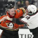 Arizona Coyotes center Liam O'Brien (38) and Anaheim Ducks left wing Nicolas Deslauriers (20) fight during the first period of an NHL hockey game in Anaheim, Calif., Friday, Dec. 17, 2021. (AP Photo/Ashley Landis)