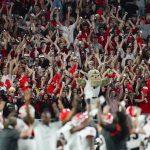 Georgia fans cheer during the second half of the Orange Bowl NCAA College Football Playoff semifinal game against Michigan, Friday, Dec. 31, 2021, in Miami Gardens, Fla. (AP Photo/Rebecca Blackwell)