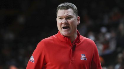 Arizona head coach Tommy Lloyd calls out to players during the second half of an NCAA college baske...