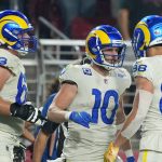 Los Angeles Rams wide receiver Cooper Kupp (10) celebrates his touchdown against the Arizona Cardinals with guard Austin Corbett (63) and tight end Brycen Hopkins (88) during the second half of an NFL football game Monday, Dec. 13, 2021, in Glendale, Ariz. (AP Photo/Rick Scuteri)