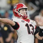 Georgia quarterback Stetson Bennett passes against Michigan during the first half of the Orange Bowl NCAA College Football Playoff semifinal game, Friday, Dec. 31, 2021, in Miami Gardens, Fla. (AP Photo/Lynne Sladky)