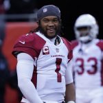 Arizona Cardinals quarterback Kyler Murray smiles as he warms up before an NFL football game against the Chicago Bears Sunday, Dec. 5, 2021, in Chicago. (AP Photo/David Banks)