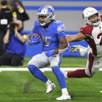 Detroit Lions running back Godwin Igwebuike (35) outruns Arizona Cardinals inside linebacker Zaven Collins (25) during the first half of an NFL football game, Sunday, Dec. 19, 2021, in Detroit. (AP Photo/Lon Horwedel)