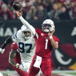 dArizona Cardinals quarterback Kyler Murray (1) throws as Indianapolis Colts defensive end Al-Quadin Muhammad (97) pursues during the second half of an NFL football game, Saturday, Dec. 25, 2021, in Glendale, Ariz. (AP Photo/Ross D. Franklin)
