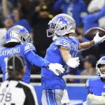 Detroit Lions wide receivers Amon-Ra St. Brown, right, and Kalif Raymond celebrate after St. Brown's 37-yard reception for a touchdown during the first half of an NFL football game against the Arizona Cardinals, Sunday, Dec. 19, 2021, in Detroit. (AP Photo/Lon Horwedel)