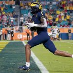 Michigan wide receiver Andrel Anthony scores against Georgia during the second half of the Orange Bowl NCAA College Football Playoff semifinal game, Friday, Dec. 31, 2021, in Miami Gardens, Fla. (AP Photo/Lynne Sladky)