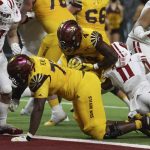 Arizona State running back Daniyel Ngata (4) scores a touchdown against Wisconsin during the second half of the Las Vegas Bowl NCAA college football game Thursday, Dec. 30, 2021, in Las Vegas. (AP Photo/L.E. Baskow)