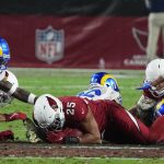 Arizona Cardinals inside linebacker Zaven Collins (25) recovers an onside kick against the Los Angeles Rams during the second half of an NFL football game Monday, Dec. 13, 2021, in Glendale, Ariz. (AP Photo/Rick Scuteri)