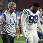 Indianapolis Colts head coach Frank Reich and defensive tackle DeForest Buckner (99) leave the field after an NFL football game against the Arizona Cardinals, Saturday, Dec. 25, 2021, in Glendale, Ariz. The Colts won 22-16. (AP Photo/Rick Scuteri)