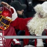 Arizona Cardinals fans cheer during the second half of an NFL football game against the Indianapolis Colts, Saturday, Dec. 25, 2021, in Glendale, Ariz. (AP Photo/Rick Scuteri)