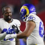 Los Angeles Rams outside linebacker Von Miller, left, celebrates a win over the Arizona Cardinals with offensive lineman Jeremiah Kolone (60) after an NFL football game Monday, Dec. 13, 2021, in Glendale, Ariz. (AP Photo/Ralph Freso)