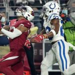 Arizona Cardinals wide receiver Christian Kirk, left, can't make the catch as Indianapolis Colts cornerback Kenny Moore II defends during the first half of an NFL football game, Saturday, Dec. 25, 2021, in Glendale, Ariz. (AP Photo/Rick Scuteri)