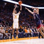 Tennessee guard Santiago Vescovi shoots over Arizona guard Kerr Kriisa during an NCAA college basketball game Wednesday, Dec. 22, 2021, in Knoxville, Tenn. (AP Photo/Wade Payne)