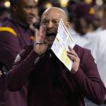 Minnesota coach P.J. Fleck yells to the defense during the first half of the team's Guaranteed Rate Bowl NCAA college football game against West Virginia on Tuesday, Dec. 28, 2021, in Phoenix. (AP Photo/Rick Scuteri)