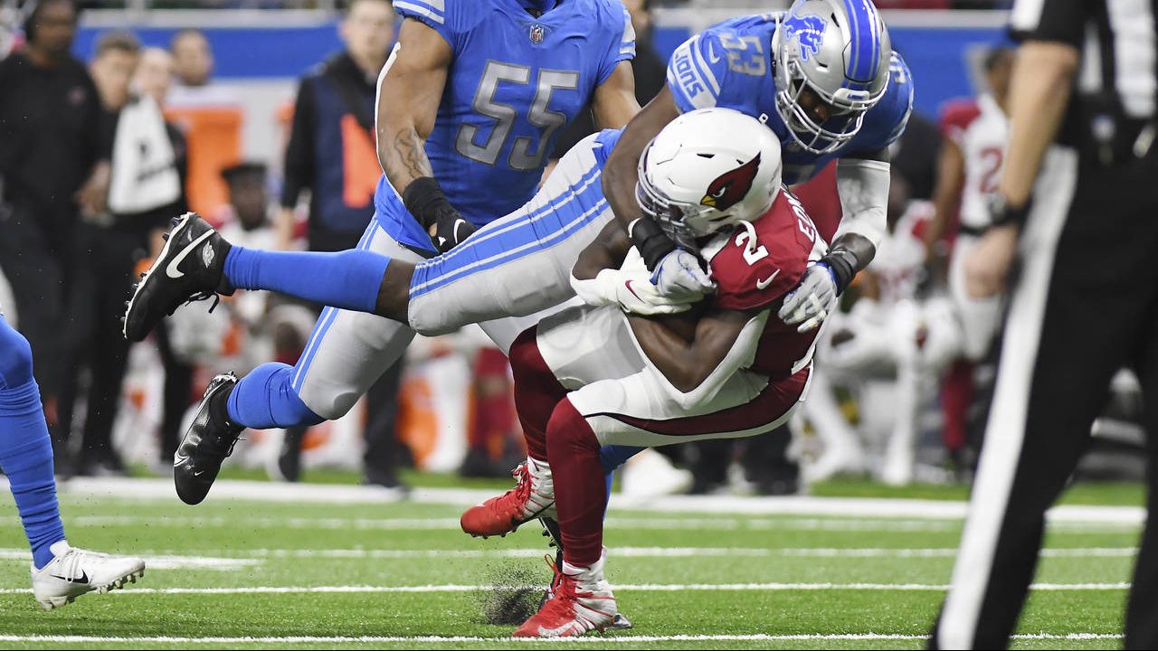 Arizona Cardinals running back Chase Edmonds (2) is stopped by Detroit Lions outside linebacker Cha...