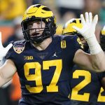 Michigan defensive end Aidan Hutchinson gestures during the first half of the Orange Bowl NCAA College Football Playoff semifinal game against Georgia, Friday, Dec. 31, 2021, in Miami Gardens, Fla. (AP Photo/Lynne Sladky)