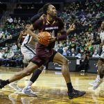 Arizona State forward Kimani Lawrence (4) drives against Oregon during an NCAA college basketball game in Eugene, Ore., Sunday, Dec. 5, 2021. (AP Photo/Thomas Boyd)
