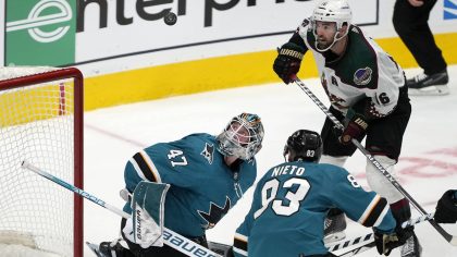 Arizona Coyotes left wing Andrew Ladd, top right, scores a goal over San Jose Sharks goaltender Jam...