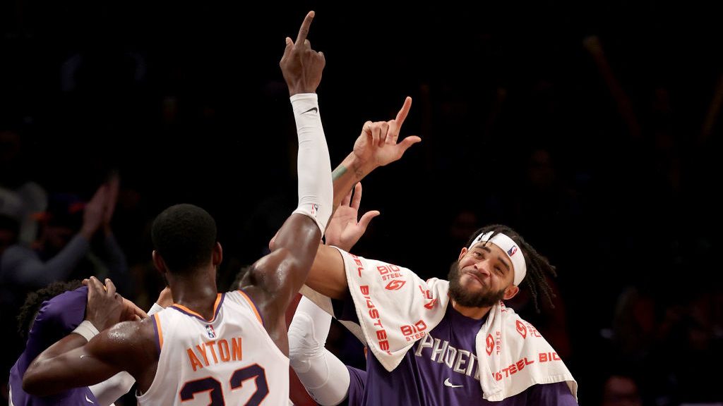 JaVale McGee #00 of the Phoenix Suns celebrates with Deandre Ayton #22 late in the fourth quarter a...