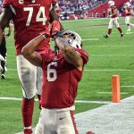 Cardinals RB James Conner does signature celebration after his first TD against Seattle 1/09/22 (Jeremy Schnell/Arizona Sports)