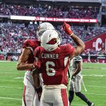 Cardinals RB James Conner points to the sky after scoring a TD 1/09/22 (Jeremy Schnell/Arizona Sports)