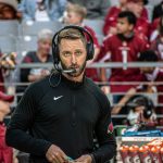 Cardinals head coach Kliff Kingsbury standing on sideline with headset on 1/09/22 (Jeremy Schnell/Arizona Sports)