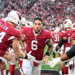 Cardinals RB James Conner announced to the crowd and goes throw high five line 1/09/22 (Jeremy Schnell/Arizona Sports)