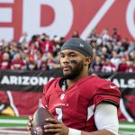 Cardinals QB Kyler Murray warming up on the sideline with helmet off 1/09/22 (Jeremy Schnell/Arizona Sports)