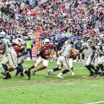 Cardinals LB Chandler Jones rushes after Seahawks QB Russell Wilson 1/09/22 (Jeremy Schnell/Arizona Sports)