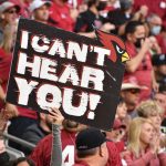 Cardinals fans at State Farm Stadium hold an "I Can't Hear You" sign 1/09/22 (Jeremy Schnell/Arizona Sports)