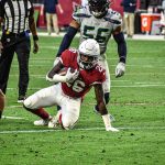 Cardinals RB Eno Benjamin gets up after a nice run 1/09/22 (Jeremy Schnell/Arizona Sports)