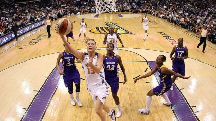 Penny Taylor #13 of the Phoenix Mercury lays up a shot past 	Jantel Lavender #42 of the Los Angeles...