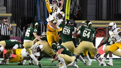 Colorado State Rams place kicker Robert Liss (96) kicks a field goal against the Wyoming Cowboys in...