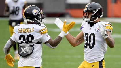 Jaylen Samuels #38 and James Conner #30 of the Pittsburgh Steelers high five before the game agains...