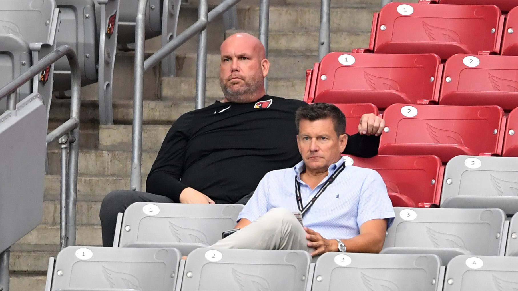 Owner Michael Bidwill (R) and general manager Steve Keim of the Arizona Cardinals look on during tr...