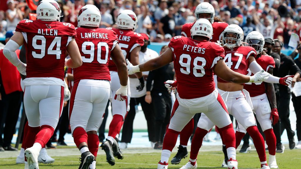Corey Peters #98 and Zeke Turner #47 of the Arizona Cardinals celebrate against the Tennessee Titan...