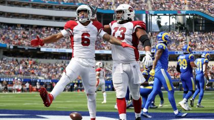 James Conner #6 of the Arizona Cardinals celebrates his touchdown with Max Garcia #73 in the second...