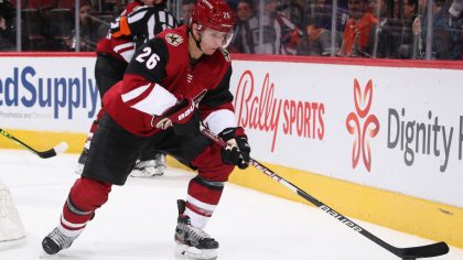 Antoine Roussel #26 of the Arizona Coyotes skates with the puck during the NHL game at Gila River A...
