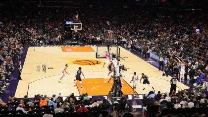 General view of action as Landry Shamet #14 of the Phoenix Suns puts up a three-point shot against ...