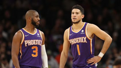 Chris Paul #3 and Devin Booker #1 of the Phoenix Suns during the second half of the NBA game at Foo...