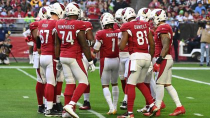 Kyler Murray #1 of the Arizona Cardinals calls a play in the huddle against the Seattle Seahawks at...