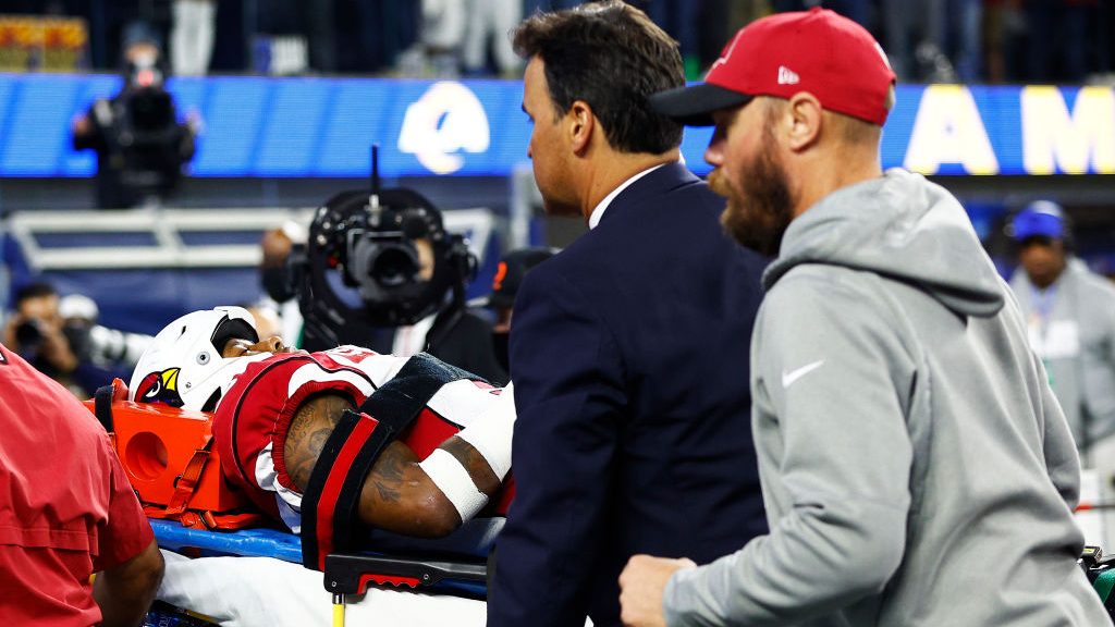 Budda Baker #3 of the Arizona Cardinals is carted off the field after an injury during the third qu...