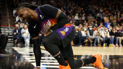 Jae Crowder #99 of the Phoenix Suns reacts to an injury during the second half of the NBA game agai...